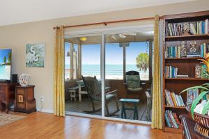 a living room with a view of the ocean at Summer Breeze by Pristine Properties Vacation Rentals in Indian Pass