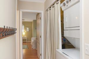 a kitchen with a white stove top oven next to a microwave at Summer Breeze by Pristine Properties Vacation Rentals in Indian Pass +57 photos
