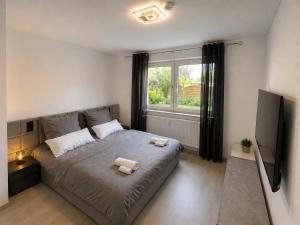 a bedroom with a bed with two towels on it at Harpener Hellweg 457 in Bochum
