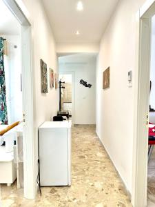 a bathroom with a white vanity and a mirror at Casa della Nonna - Art & Vintage Rooms in Noicattaro