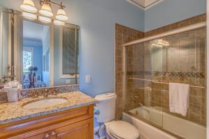 a bathroom with a toilet and a shower and a sink at Island Idyl by Pristine Properties Vacation Rentals in Indian Pass +18 photos
