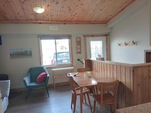 a dining room with a wooden table and chairs at Guest Suite in Smiths Falls