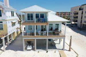 an aerial view of a house on the beach at Shore Looks Good by Pristine Properties Vacation Rentals in Mexico Beach