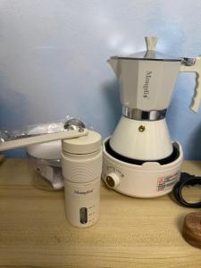 a blender sitting on top of a wooden table at Carmela Haven Inn in Baler