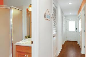 a bathroom with a sink and a mirror at Sun Chaser by Pristine Properties Vacation Rentals in Cape San Blas +76 photos