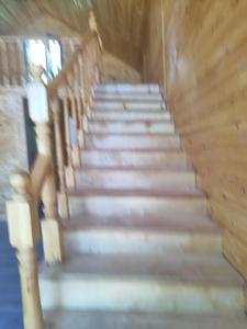 a flight of stairs with a person walking up them at Zhyrgallaif in Darkan