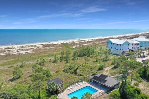an aerial view of a house and the beach at A Swell Life by Pristine Properties Vacation Rentals in Cape San Blas