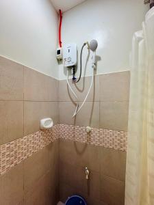 a shower in a bathroom with a blow dryer at Lavajas Guest House in San Juan +39 photos