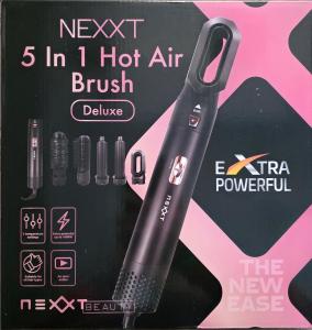 a black haptic brush in a box with other items at Nador Khattabi 2-19 in Nador