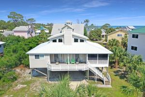 an aerial view of a white house at Boardwalk Sandpiper by Pristine Properties Vacation Rentals in Cape San Blas