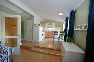 a room with a kitchen and a living room at Classic Leksand in Leksand