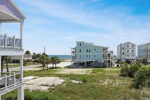 a view of the beach from the balcony of a apartment building at Lala's Place by Pristine Properties Vacation Rentals in Mexico Beach