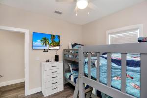 a bedroom with a bunk bed and a bunk bedwered at Beach Fantasies B by Pristine Properties Vacation Rentals in Mexico Beach