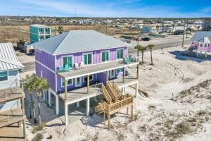 an aerial view of a purple house on the beach at Beach Fantasies B by Pristine Properties Vacation Rentals in Mexico Beach