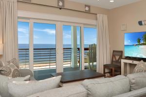 a living room with a view of the ocean at The Great White 2 by Pristine Properties Vacation Rentals in Beacon Hill