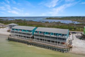 an aerial view of a building on the water at Edgewater Retreat by Pristine Properties Vacation Rentals in Cape San Blas