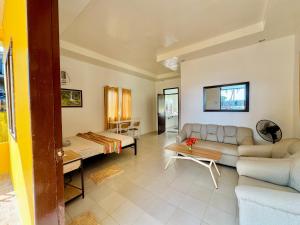 a living room with a couch and a table at Lavajas Guest House in San Juan