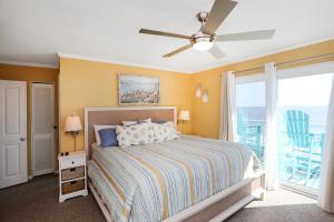 a bedroom with a bed and a ceiling fan at Pelican Crossing by Pristine Properties Vacation Rentals in Cape San Blas