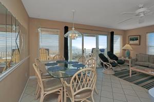 a dining room and living room with a table and chairs at Pelican Landing 3 by Pristine Properties Vacation Rentals in Indian Pass