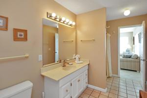 a bathroom with a sink and a mirror at Pelican Landing 3 by Pristine Properties Vacation Rentals in Indian Pass +42 photos