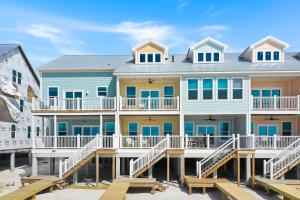 a house on the beach with a dock at Pelican's Perch by Pristine Properties Vacation Rentals in Saint Joe Beach