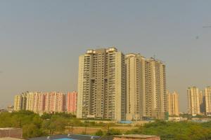 a large city with tall buildings in the background at Mehi villa in Ghaziabad
