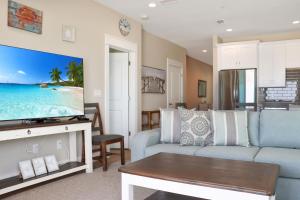 a living room with a couch and a tv at The Great White 1 by Pristine Properties Vacation Rentals in Beacon Hill