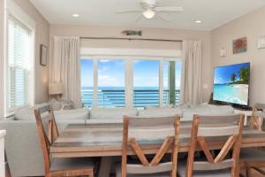 a dining room with a table and a couch at The Great White 1 by Pristine Properties Vacation Rentals in Beacon Hill