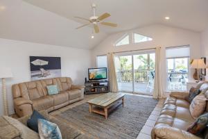 a living room with a couch and a table at 2-The-Beach by Pristine Properties Vacation Rentals in Indian Pass