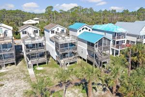 an aerial view of a large house with palm trees at A New Beginning by Pristine Properties Vacation Rentals in Indian Pass
