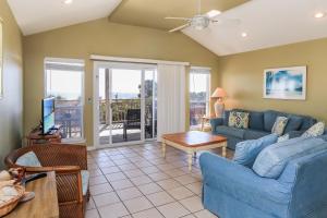 a living room with a couch and a table at A New Beginning by Pristine Properties Vacation Rentals in Indian Pass