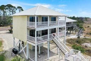 an aerial view of a house on the beach at Flamingo Dunes by Pristine Properties Vacation Rentals in Saint Joe Beach