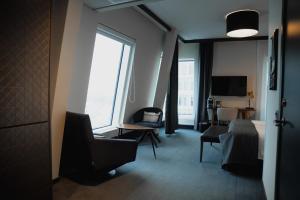 a hotel room with a bed and a window at Quality Hotel View in Malmö