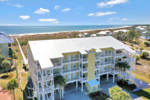 an aerial view of a condo building with the ocean in the background at Dunes Club 2A by Pristine Properties Vacation Rentals in Cape San Blas