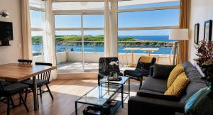 a living room with a view of the water at Les Pierres Marines in Le Conquet