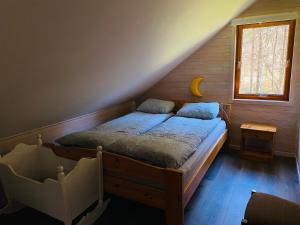 a bedroom with a bed in a attic at Leilighet toppetasje, Flekkefjord in Flekkefjord