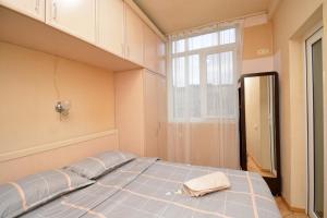 a large bed in a room with a window at The Best Apartment in Yerevan