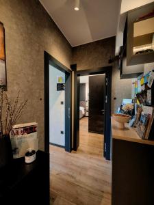 a hallway with a door leading to a bedroom at Scuderia Split Rooms in Split