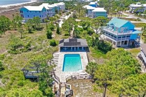 an aerial view of a resort with a swimming pool at Woofs and Waves by Pristine Properties Vacation Rentals in Cape San Blas