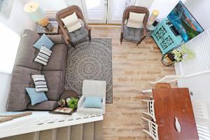 an overhead view of a living room with a couch and chairs at Narrow Escape by Pristine Properties Vacation Rentals in Cape San Blas
