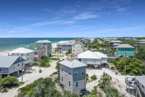 an aerial view of a town with houses and the ocean at Narrow Escape by Pristine Properties Vacation Rentals in Cape San Blas
