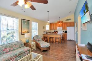 a living room with a couch and a kitchen at Sweet Destiny by Pristine Properties Vacation Rentals in Indian Pass