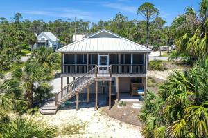 an aerial view of a house on the beach at Sweet Destiny by Pristine Properties Vacation Rentals in Indian Pass