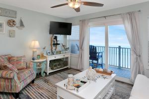 a living room with a view of the ocean at Sandcastle C by Pristine Properties Vacation Rentals in Mexico Beach