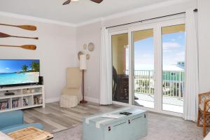 a living room with a view of the ocean at Summerhouse 309 by Pristine Properties in Mexico Beach