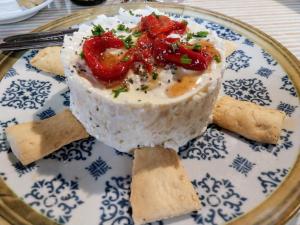 a plate of food with rice and peppers on it at Hotel Rural Inz-Almaraz in Jimera de Líbar +55 photos
