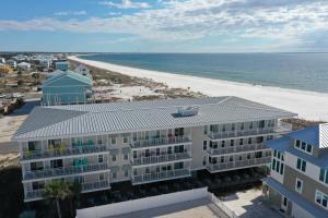 an aerial view of a building and the beach at Surfside 15 - Beachtime by Pristine Properties Vacation Rentals in Mexico Beach