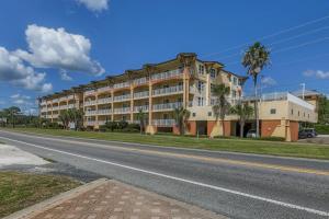 a large building on the side of a road at Summerhouse 203 by Pristine Properties Vacation Rentals in Mexico Beach