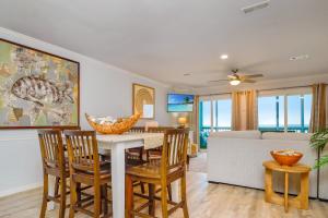 a dining room and living room with a table and chairs at Their Inheritance by Pristine Properties Vacation Rentals in Indian Pass