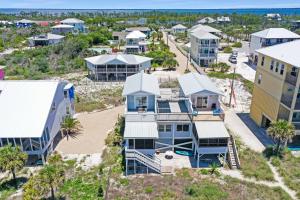 an aerial view of a resort with palm trees and condos at Whataday by Pristine Properties Vacation Rentals in Cape San Blas